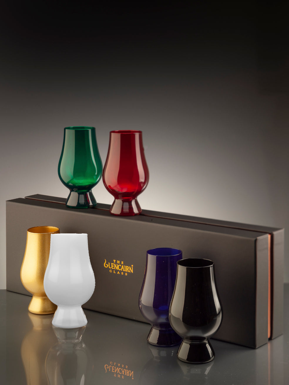  It features the world's favourite whisky glass in six different colours: black, blue, green, gold, red, and white.  Supplied in a luxury black gift box.