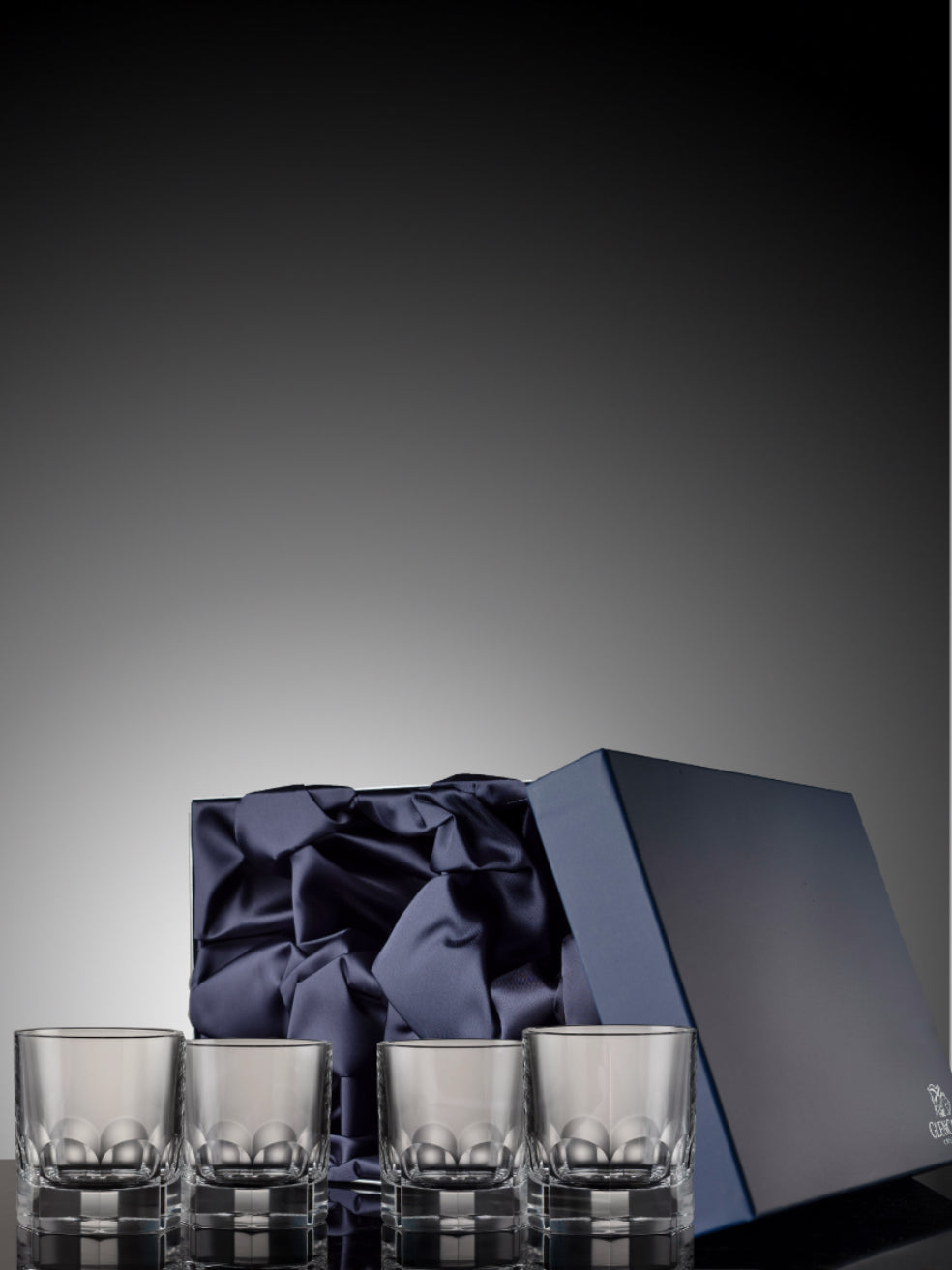 Set of four Lewis crystal whisky tumblers in a blue satin box.