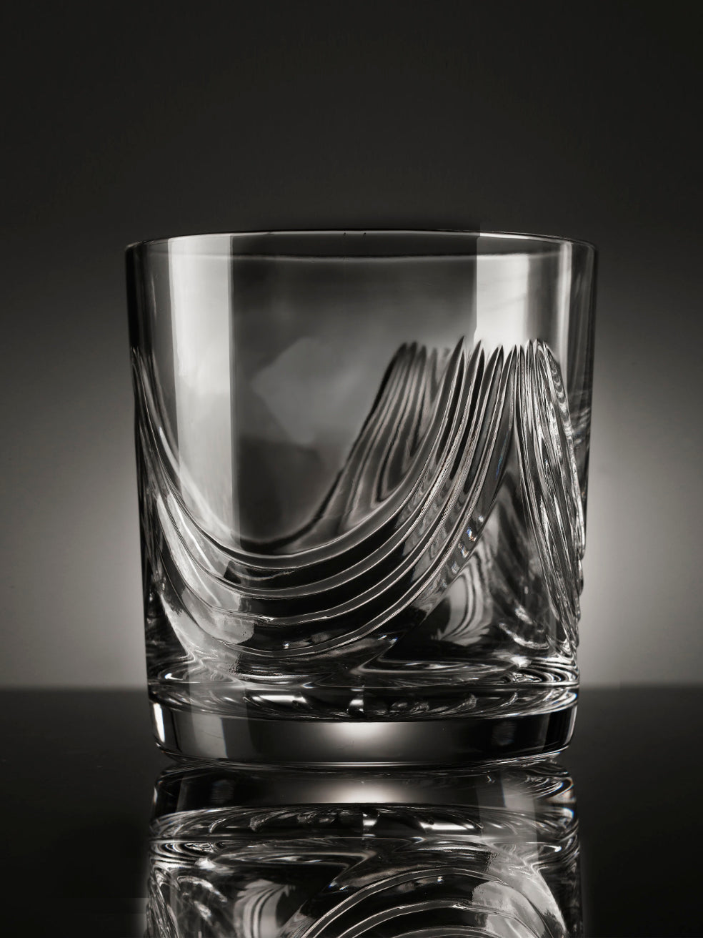 The beautiful hand-cut Montrose tumbler features sweeping cuts on the glassware inspired by the folds of the Scottish kilts.