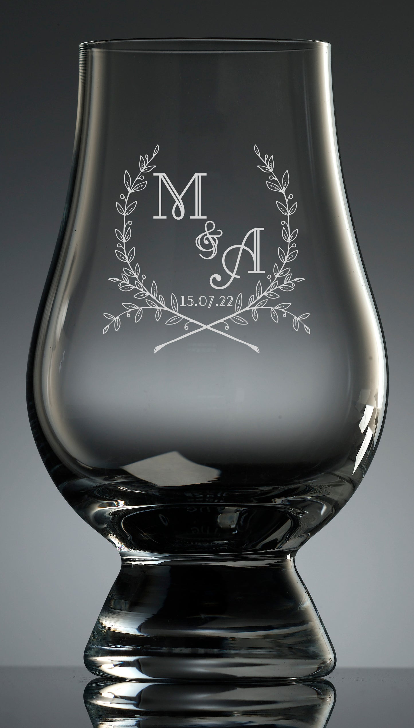 Etching of wedding wreath logo available on all glassware. No minimum order quantity. Pricing based on quantity ordered.