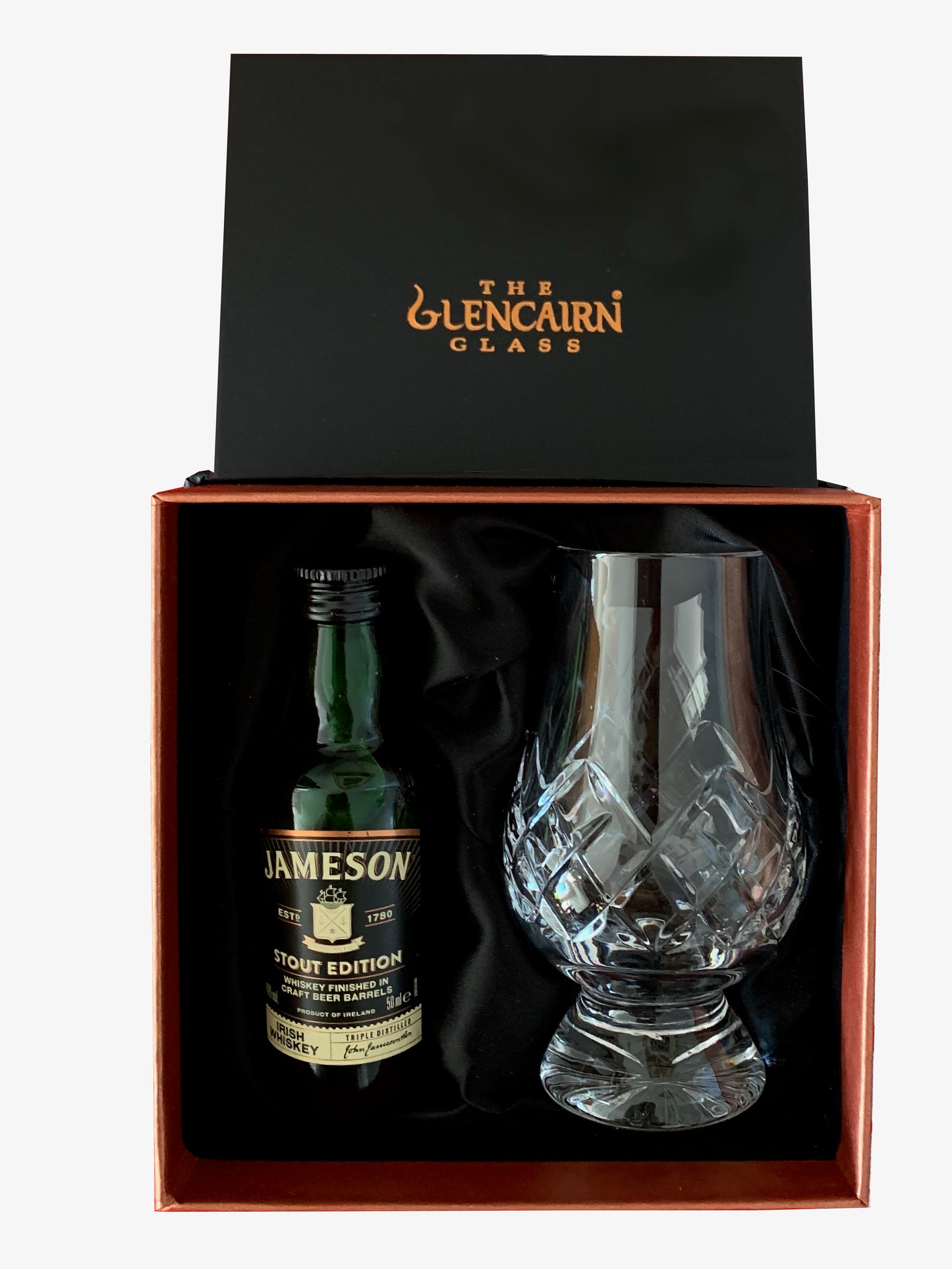 The Cut Glencairn Whisky Glass paired with a miniature bottle of Jameson Stout Edition Whisky ready to gift in a luxurious presentation box.