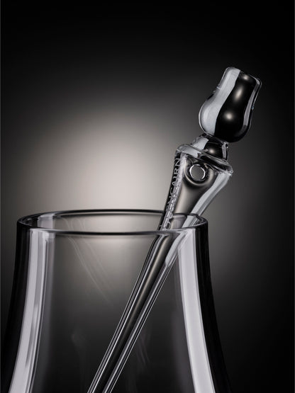 The handblown glass Glencairn Pipette is designed to be the ideal length for the Glencairn Glass. Weighted at the top with a beautiful miniature Glencairn Glass, the pipette is fashioned to be comfortable in the hand, whilst allowing better regulation of the amount of water added, with its precisely engineered control-aperture set within a wide bulb at the upper end.