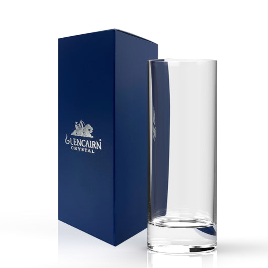 A clear crystal highball glass standing next to its dark blue branded box, which features the 'Glencarn Crystal' logo, on a clean white background.