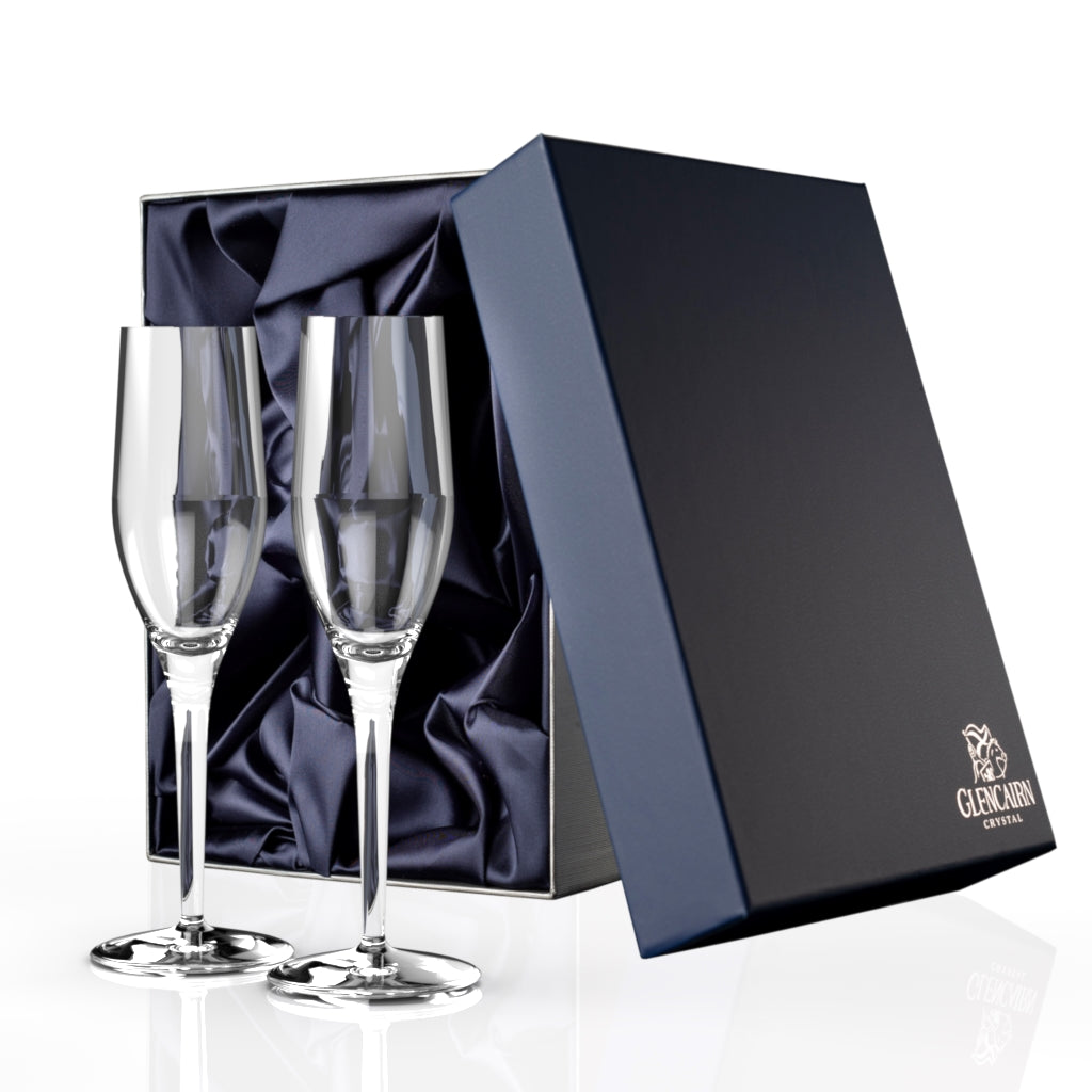 Two sleek yet elegant champagne flutes made of lead-free crystal in a luxurious blue presentation box.