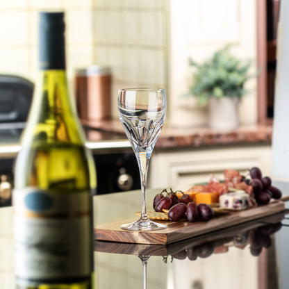 A modern interpretation on cut crystal - a solid and weighty yet fine wine glass with a thumb cut finish.