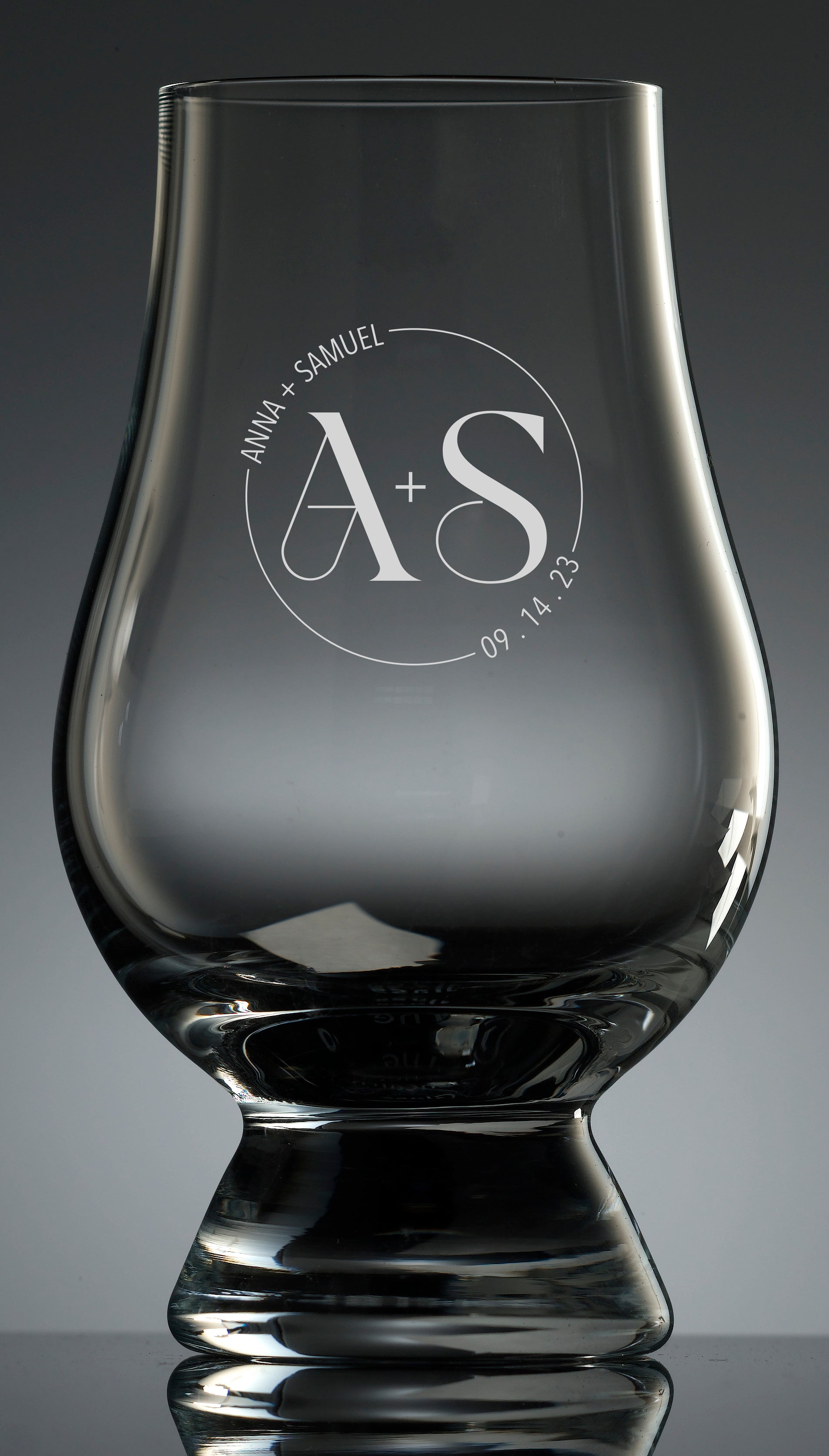 Etching of modern wedding logo available on all glassware.