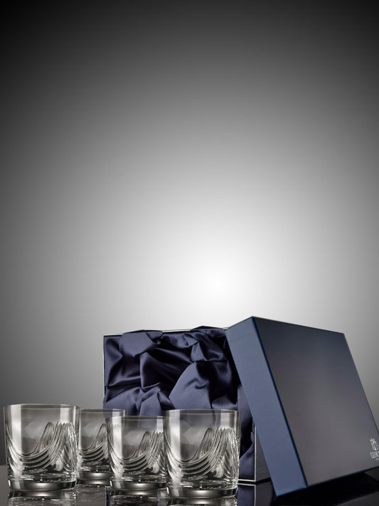 Set of four Montrose 24% lead-crystal tumblers in presentation box.