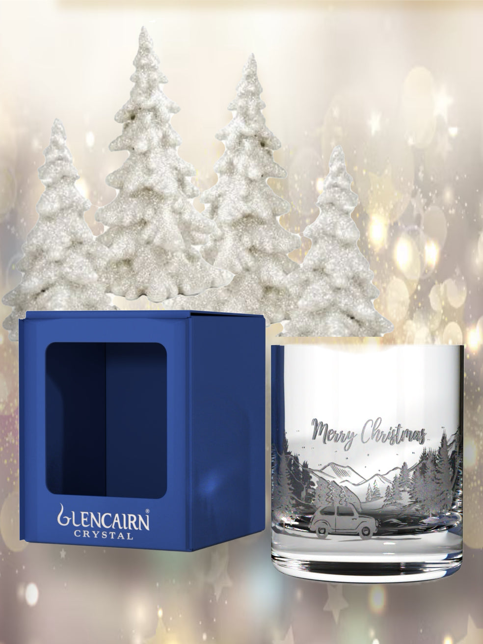 Lead-free crystal tumblers featuring bringing home the Christmas tree in a wrap-around wintery scene.